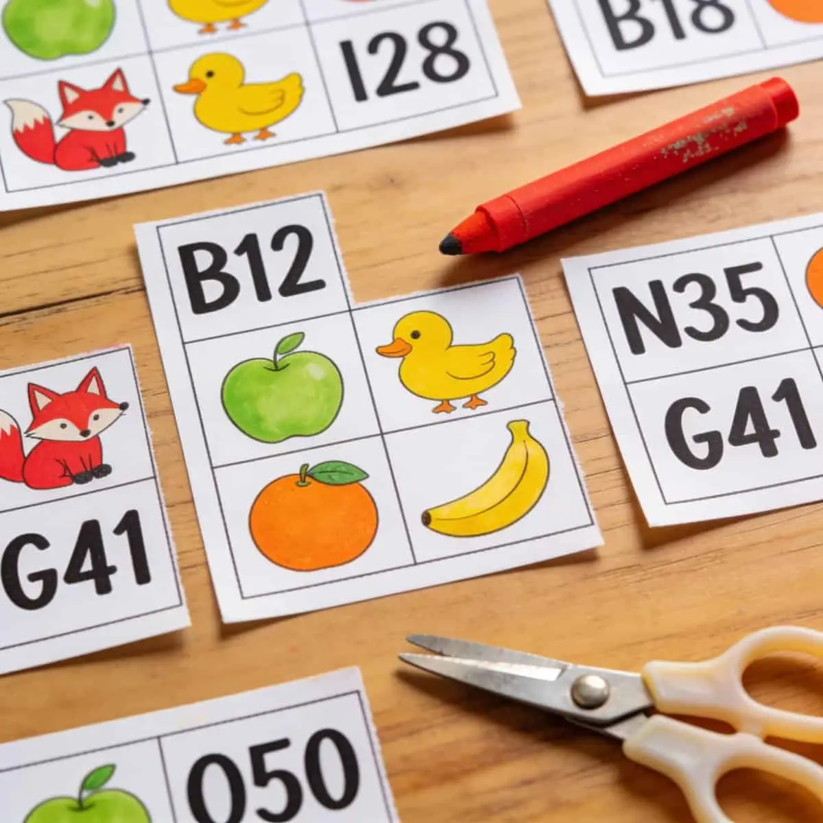 Homemade bingo cards with pictures and large numbers.